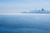 San Francisco skyline with fog and bridge